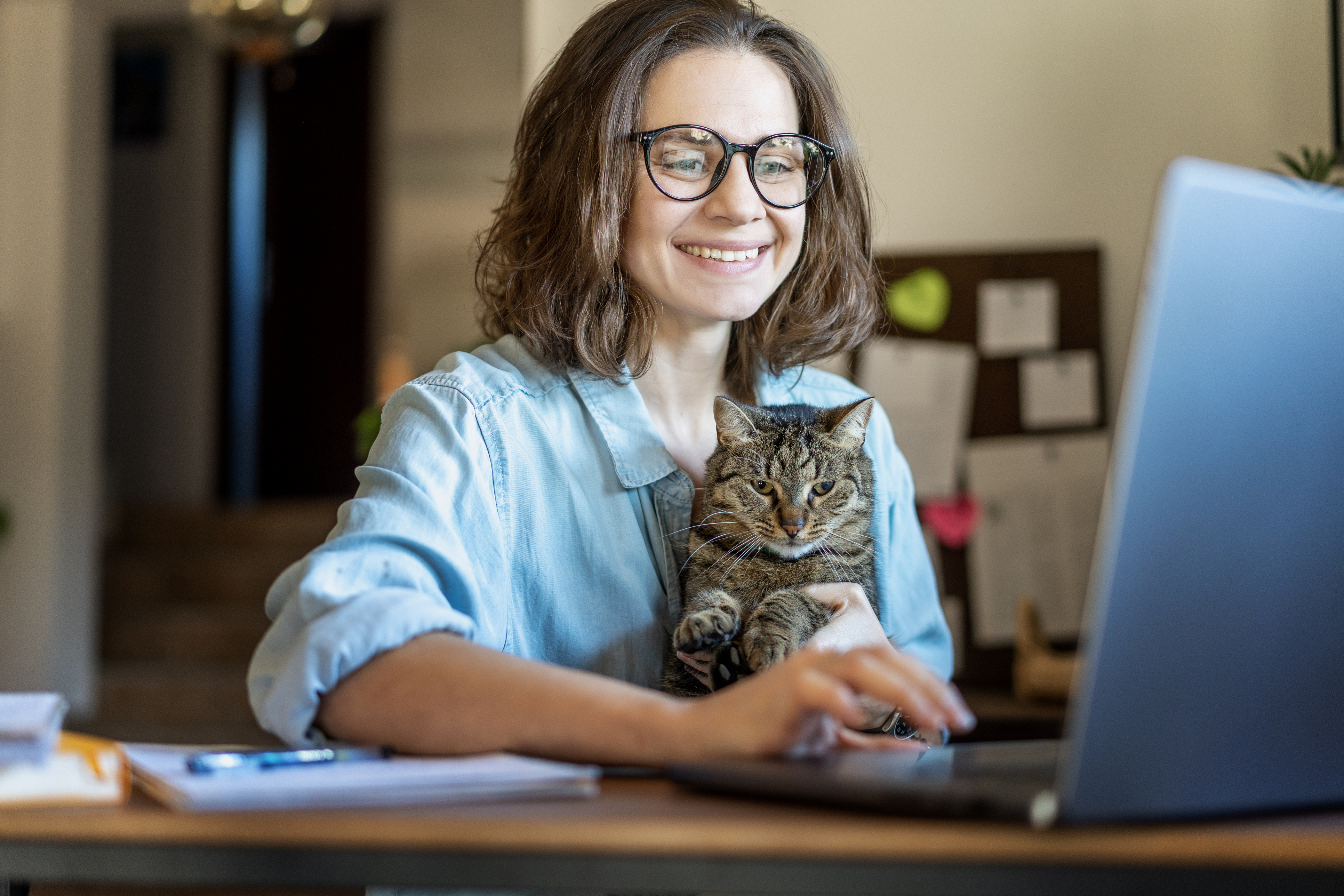 Woman browsing user profiles on a laptop